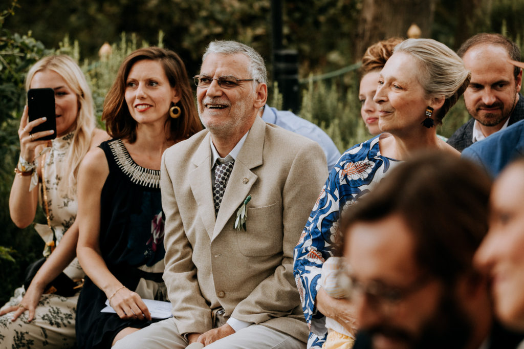 guests are laughing during the outdoors ceremony in Tuscany
